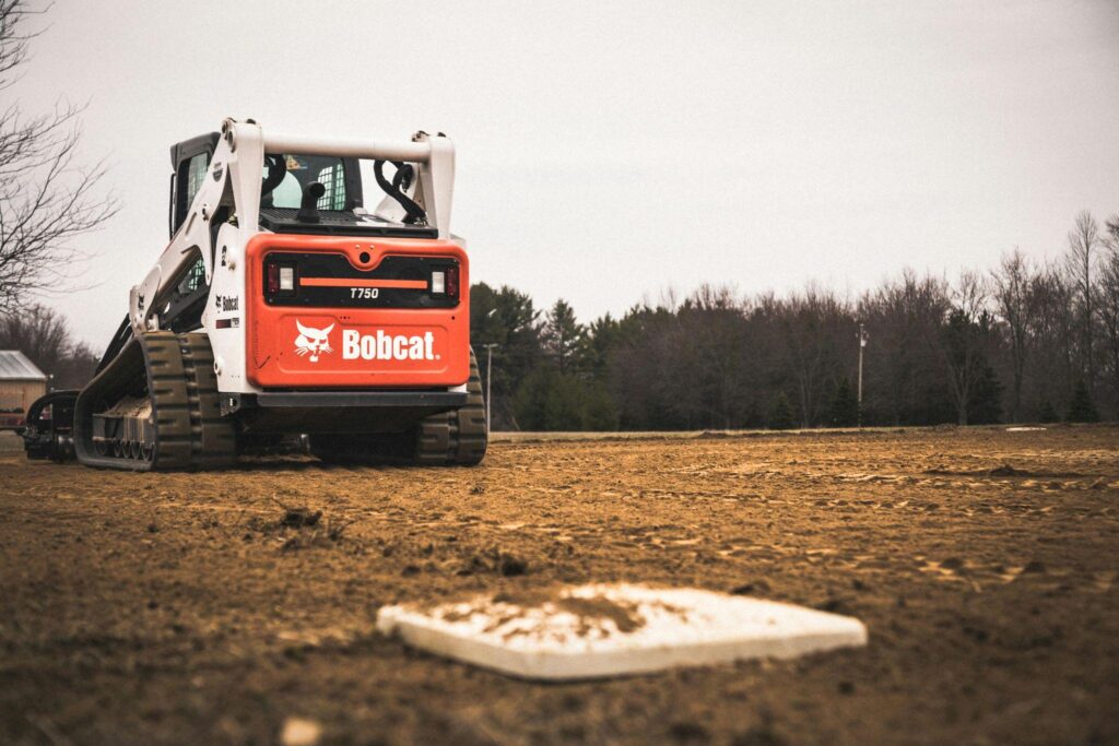 Skidsteer loader operating on a construction jobsite.